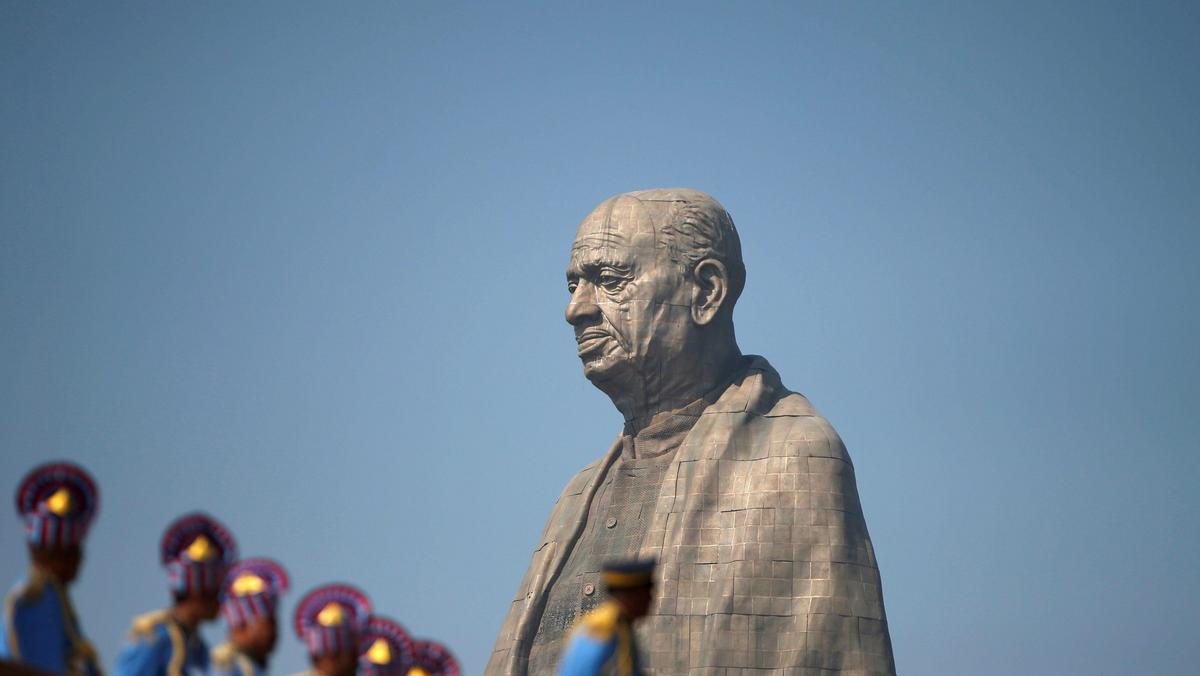 Police officers stand near the Statue of Unity portraying Sardar Vallabhbhai Patel, one of the fou