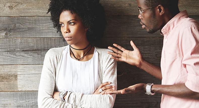 Man angrily speaking with woman [Credit: Getty]