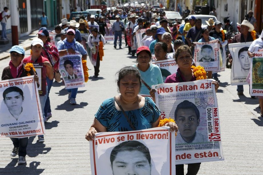 Relatives of the 43 missing students of the Ayotzinapa teacher training college march before receiving the final report on the disappearance of their sons by members of the Inter-American Commission on Human Rights (IACHR) in Tixtla, Guerrero state, Mexico, April 27, 2016.