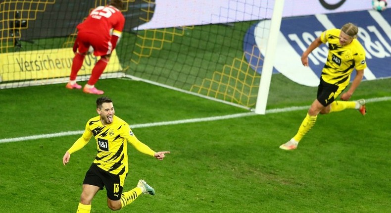 Raphael Guerreiro (L) celebrates scoring the winning goal for Dortmund in Wednesday's 2-0 home win over Union Berlin Creator: CHRISTOF KOEPSEL