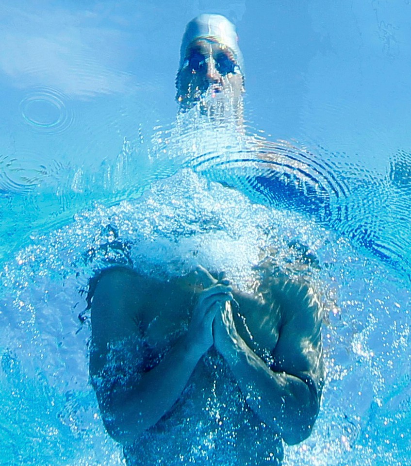 Sludnov of Russia is seen from underwater as he swims in the men's 100m breaststroke heats at the European Swimming Championships in Budapest