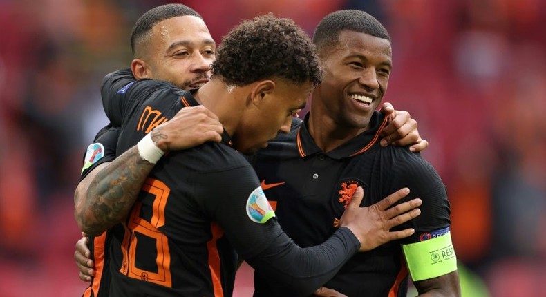 Georginio Wijnaldum (R) celebrates with Memphis Depay and Donyell Malen after scoring his second goal and the Netherlands' third against North Macedonia Creator: Kenzo Tribouillard