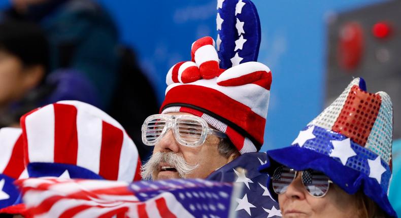 Fans look on during women's preliminary ice hockey action.