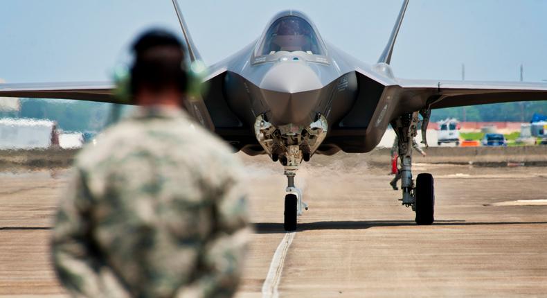 An F-35A joint strike fighter crew chief, Tech. Sgt. Brian West, watches his aircraft approach for the first time at Eglin Air Force Base on July 14, 2011.