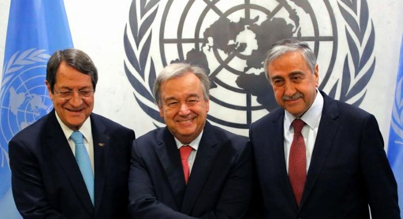 Cypriot president Nicos Anastasiades (L) and Turkish Cypriot leader Mustafa Akinci (R) with UN Secretary-General Antonio Guterres (C) at UN headquarters in New York on June 4, 2017