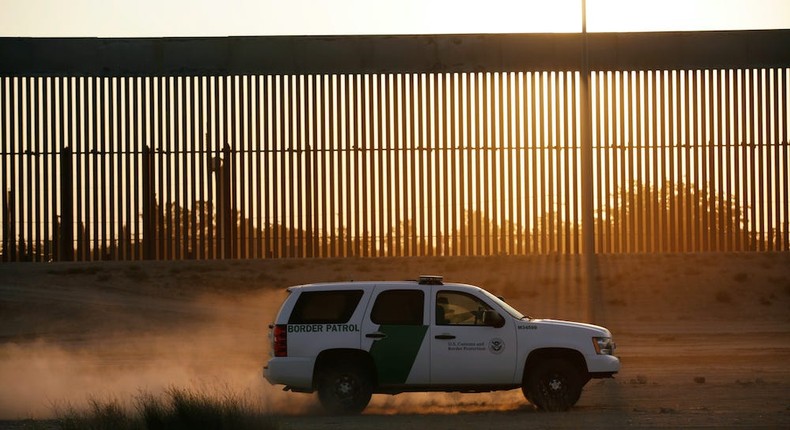 A US Customs and Border Protection vehicle patrols a new section of the border wall in El Paso, Texas, as seen from Ciudad Juarez, Mexico, on August 27, 2020.
