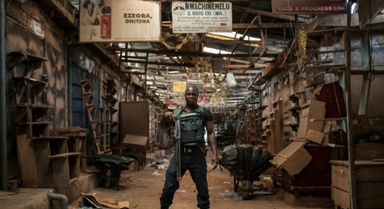 A security guard stands in the empty Ogbaru Market as shops and businesses shut down to mark the anniversary of the Biafra independence declaration