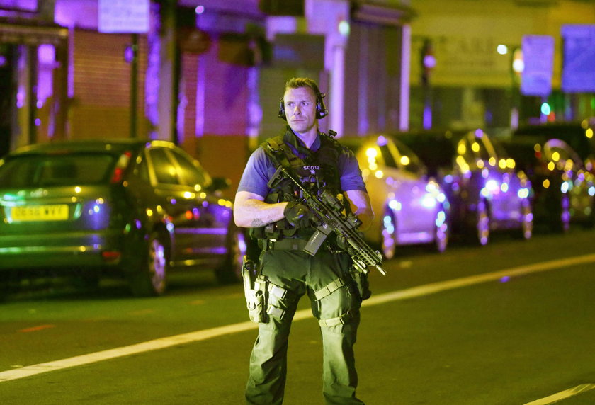 A man prays after a vehicle collided with pedestrians near a mosque in the Finsbury Park neighborhoo