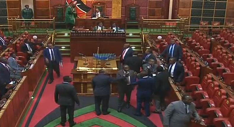 Marakwet East MP Kangogo Bowen and Homa Bay Town MP Peter Kaluma in fight within Parliament chambers