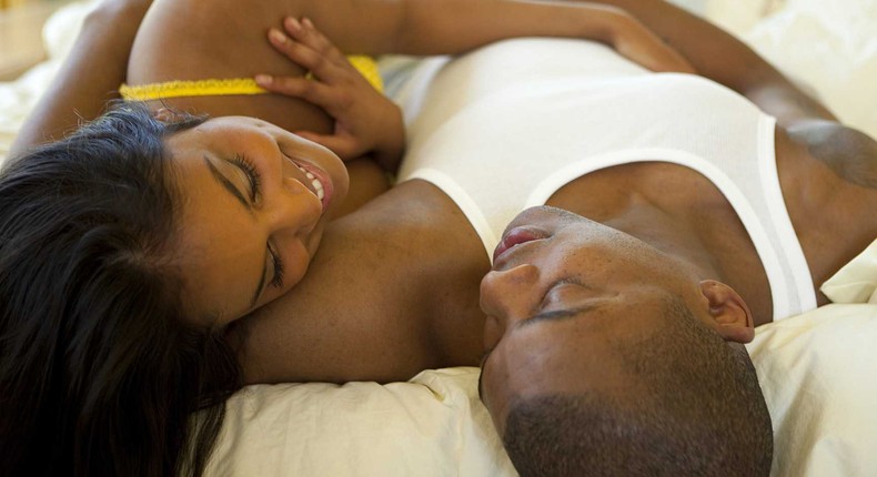 Black couple in bed (Courtesy)