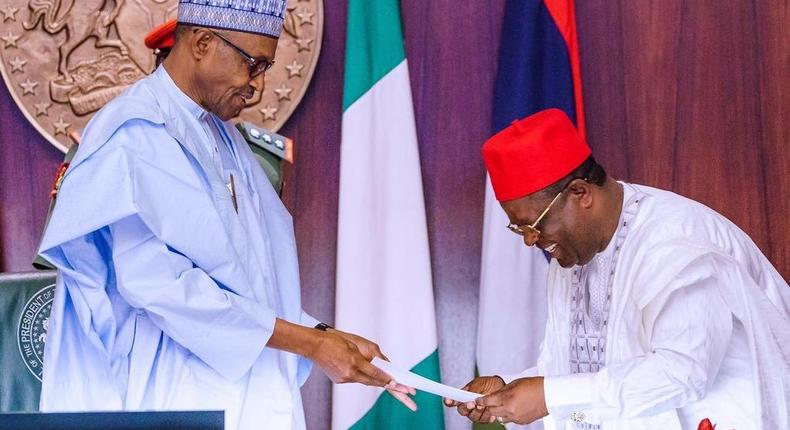 Ebonyi State governor, Dave Umahi (right) has told President Muhammadu Buhari (left) he wants to succeed him in 2023 [Presidency]