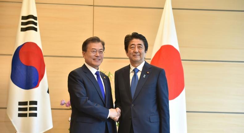 South Korea's President Moon Jae-in in happier times with Japan's Prime Minister Shinzo Abe