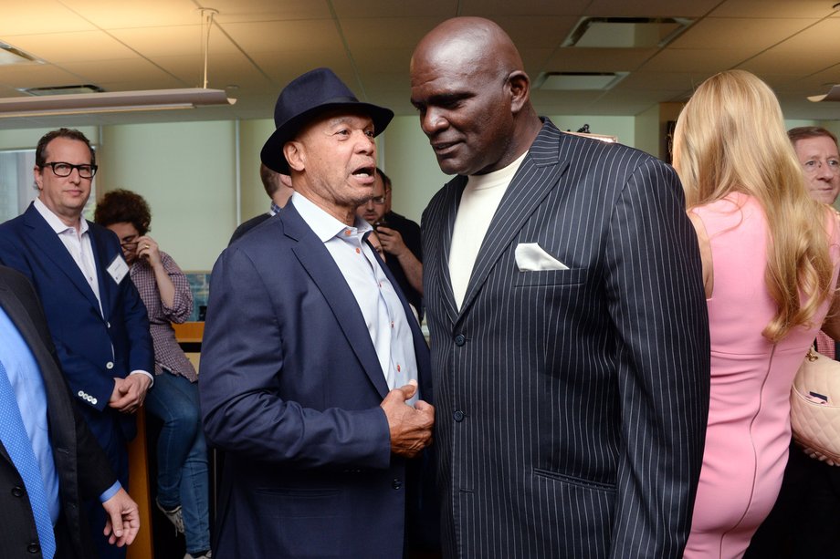 Reggie Jackson speaks with Lawrence Taylor.