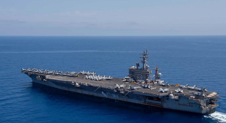 The Nimitz-class aircraft carrier USS Dwight D. Eisenhower and the French aircraft carrier FS Charles De Gaulle participate in a photo exercise in the Mediterranean Sea on May 2.US Navy photo by Mass Communication Specialist 2nd Class Eric Edinger/Released