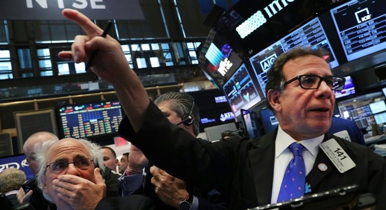 Traders work on the floor of the New York Stock Exchange the morning after Donald Trump's victory