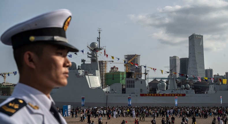 A Chinese sailor stands guard in April at celebrations of the 75th anniversary of the founding of China's navy. Kevin Frayer/Getty Images