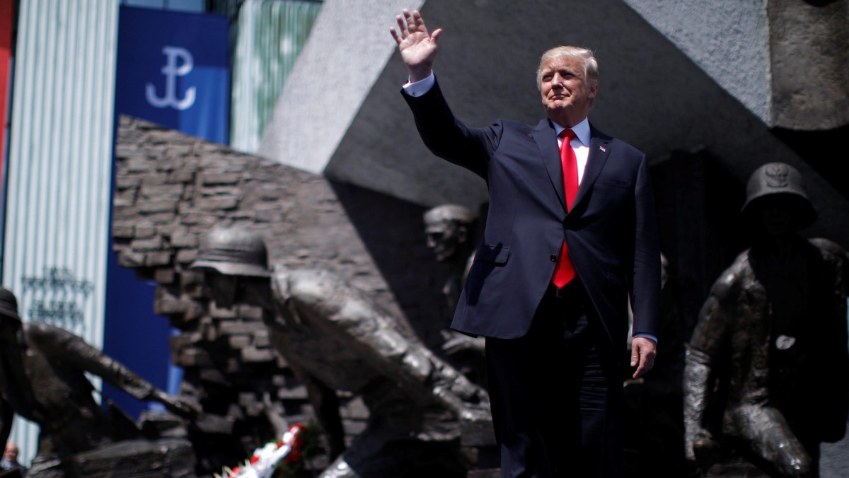 U.S. President Donald Trump waves as he arrives to hold a public speech in front of the Warsaw Upris