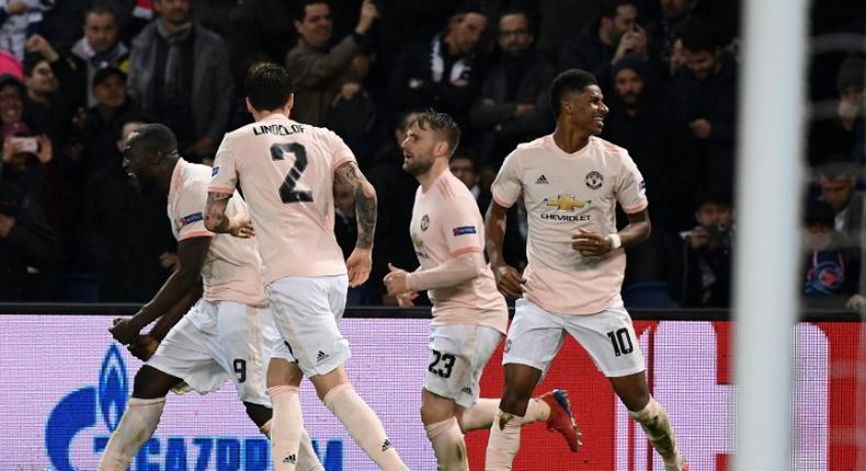 Manchester United pull of a shocking 3-1 win at PSG to progress in the Champions ,League (AFP)