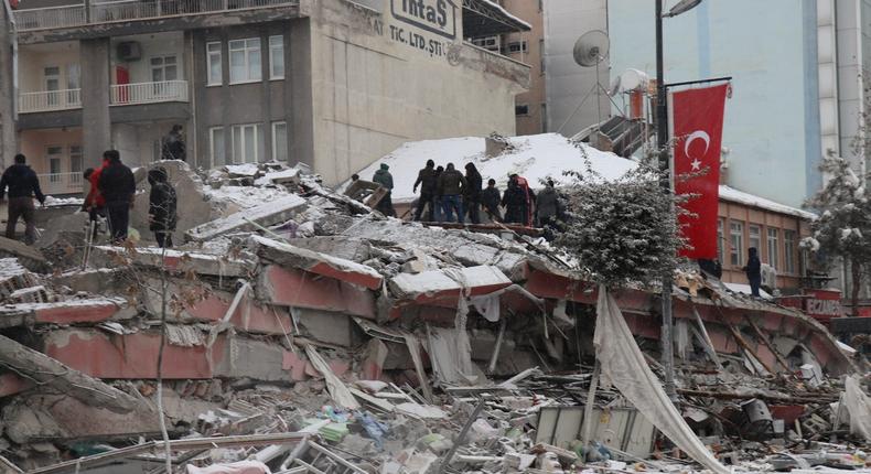 Rescuers carry out a person from a collapsed building after an earthquake in Malatya, Turkey February 6, 2023Ihlas News Agency via Reuters