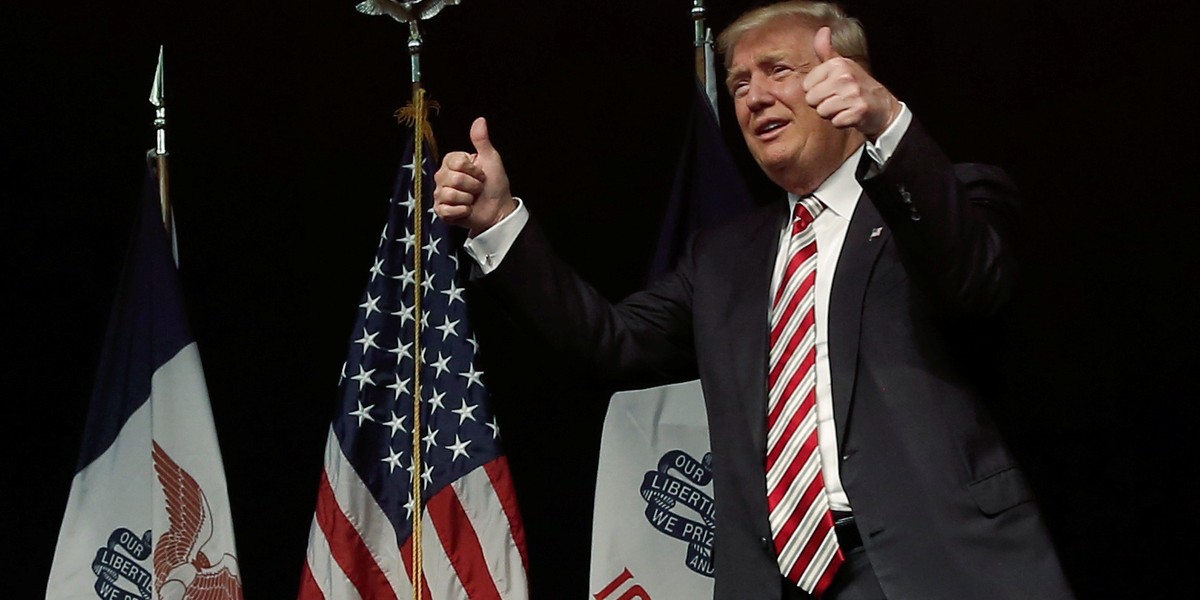 Donald Trump takes the stage for a campaign rally in Clive, Iowa, U.S., September 13, 2016.