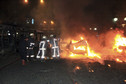 Emergency personnel work near a burning vehicle after an explosion in Ankara