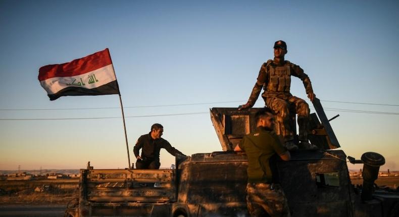 Iraqi forces drive their vehicle near Gogjali, on the eastern edge of Mosul, on November 3, 2016 during their ongoing operation against jihadists of the Islamic State group to retake the city