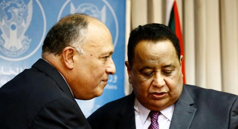 Sudanese Foreign Minister Ibrahim Ghandour (R) speaks with his Egyptian counterpart Sameh Shokry following a joint press conference in Khartoum on April 20, 2017