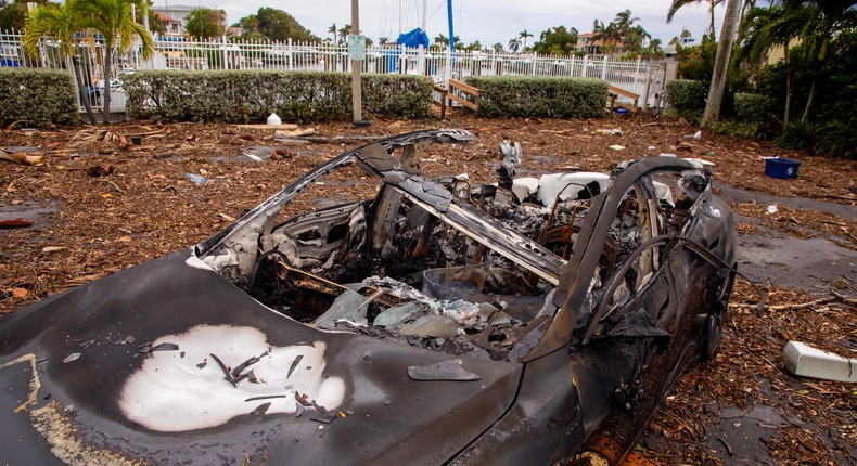 A burnt-out Tesla that exploded when it took on salt water from Hurricane Helene. Florida Gov. Ron DeSantis told EV owners last week to get their vehicles to higher ground.The Washington Post/Getty Images