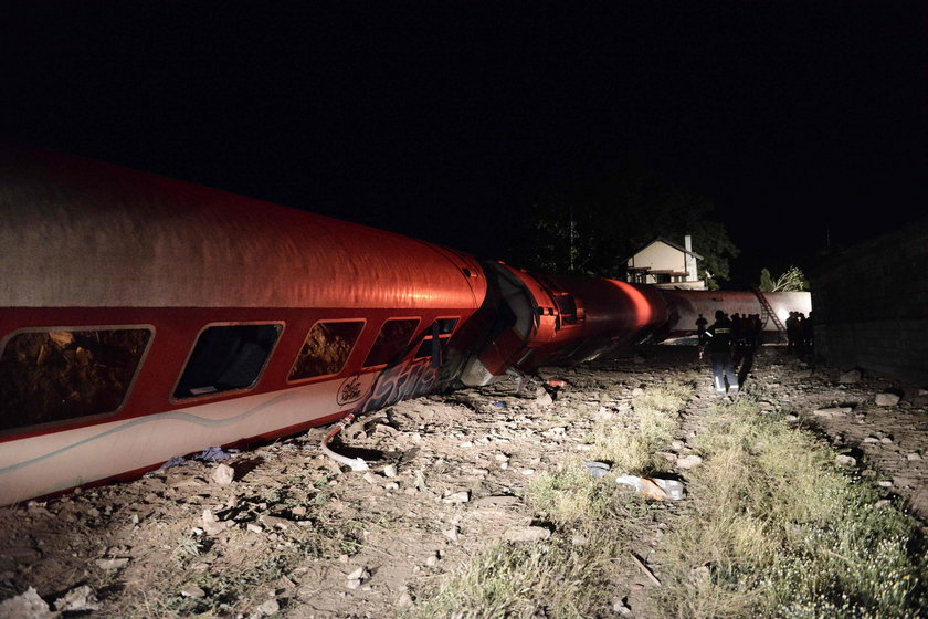 A derailed train carriage is seen toppled in the town of Adendro in northern Greece