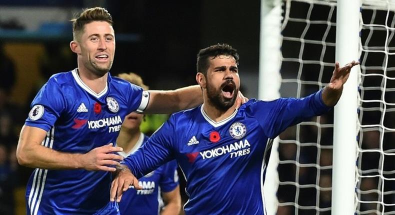 Chelsea's Diego Costa (R) celebrates with teammate Gary Cahill after scoring a goal during an English Premier League match against Everton, at Stamford Bridge in London, on November 5, 2016