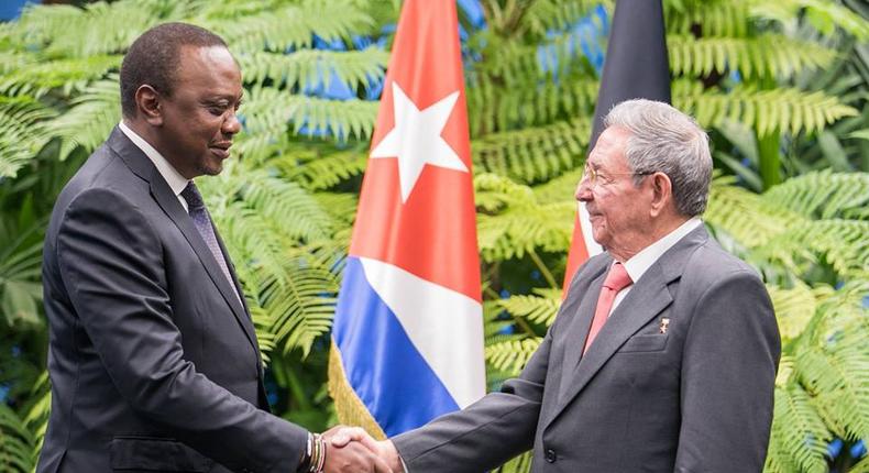 President Uhuru Kenyatta shakes hands with Cuban President Raul Castro in Cuba on March 15, 2019