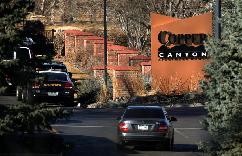A vehicle leaves the Copper Canyon apartments, the scene of the incident where deputies and civilian