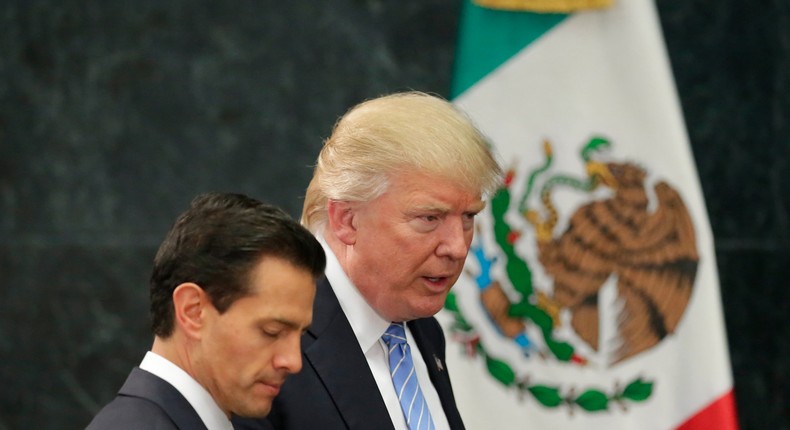 Donald Trump and Mexico's President Enrique Pena Nieto arrive for a press conference at the Los Pinos residence in Mexico City.