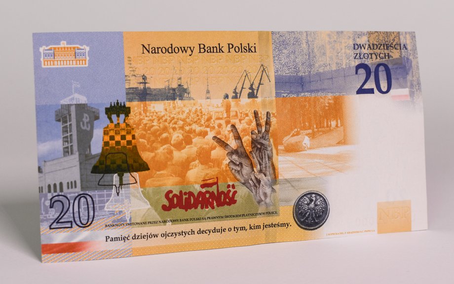 Tylna strona banknotu - Muzeum Powstania Warszawskiego oraz dźwigi gdańskiej stoczni