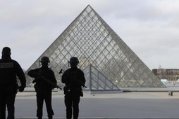 French police secure the site near the Louvre Pyramid in Paris