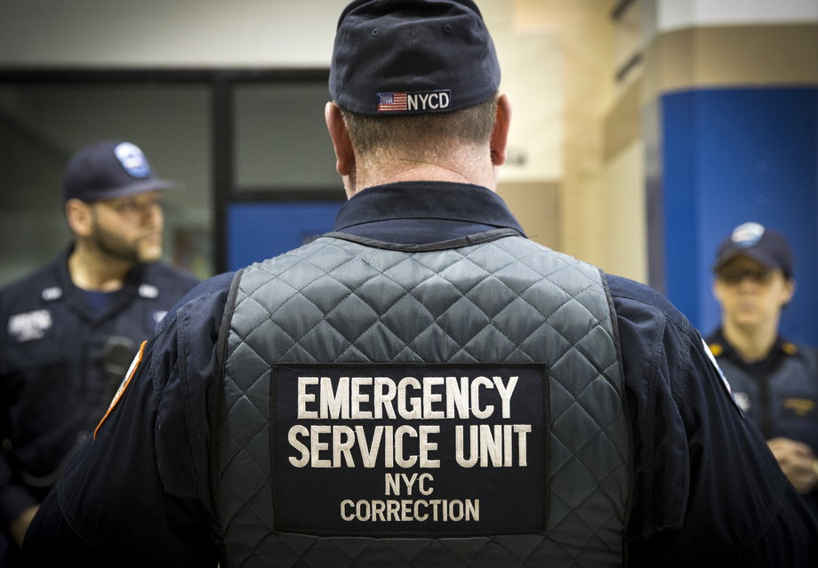 Corrections officers work in the Enhanced Supervision Housing Unit at the Rikers Island Correctional facility in New York March 12, 2015.