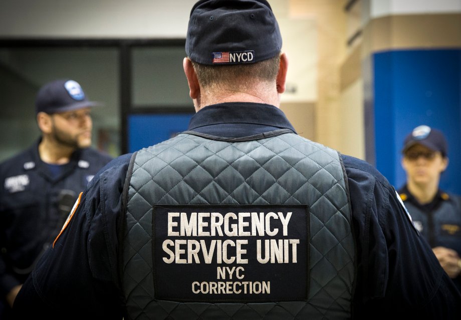 Corrections officers work in the Enhanced Supervision Housing Unit at the Rikers Island Correctional facility in New York March 12, 2015.