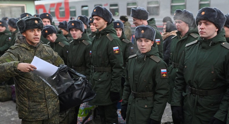 Russian conscripts called up for military service wait to board a train at a railway station in Omsk on November 27, 2022.REUTERS/Alexey Malgavko