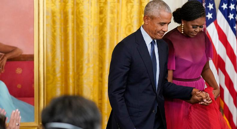 Former President Barack Obama holds hands with former first lady Michelle Obama in September 2022.Andrew Harnik/AP Photo