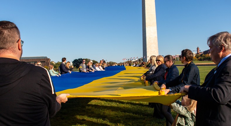 About 150 activists gathered to unfurl a large Ukrainian flag by the Washington Monument on Oct. 24 in Washington, DC.Charles R. Davis/Insider