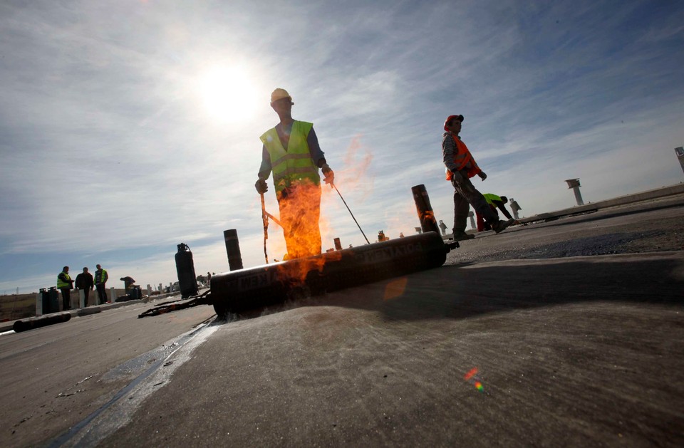 Workers are seen on the construction site of the delayed Lyulin highway, near capital Sofia