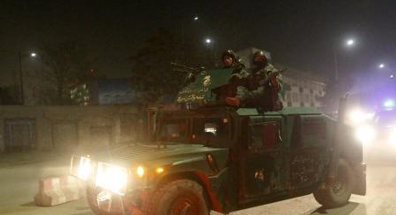 Afghan policemen arrive at the site of a Taliban attack in the Afghan capital of Kabul, Afghanistan December 11, 2015.