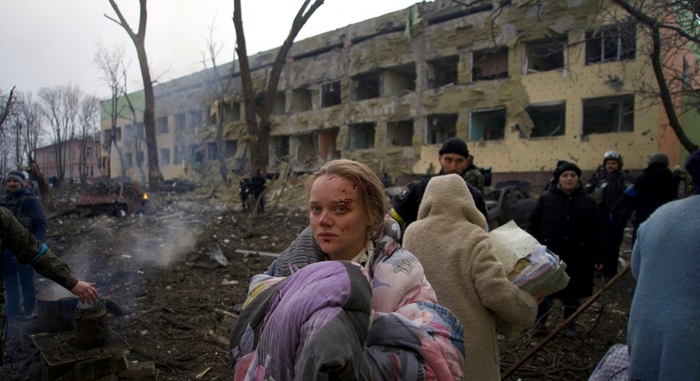 Mariana Vishegirskaya stands outside a maternity hospital that was damaged by Russian shelling in Mariupol, Ukraine, on March 9, 2022. Vishegirskaya survived the shelling and later gave birth to a girl in another hospital in Mariupol.