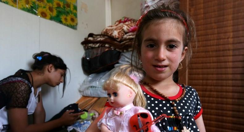 Christina, 6, is reunited with her family three years after her abduction by jihadists in Iraq