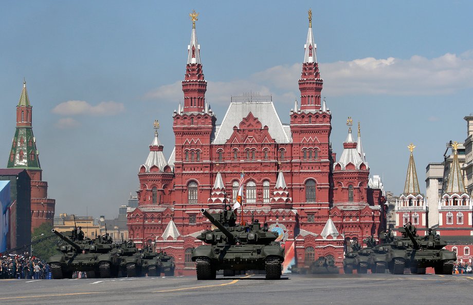 Russian servicemen stand atop T-90A main battle tanks during the Victory Day parade, marking the 71st anniversary of the victory over Nazi Germany in World War Two, at Red Square in Moscow, Russia, May 9, 2016.