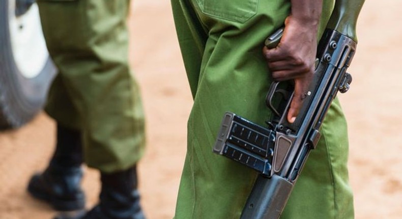 A Kenyan police officer holding a gun (Courtesy)