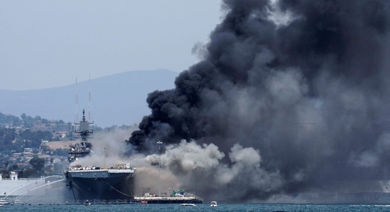 Smoke rises from a fire on board the U.S. Navy amphibious assault ship USS Bonhomme Richard