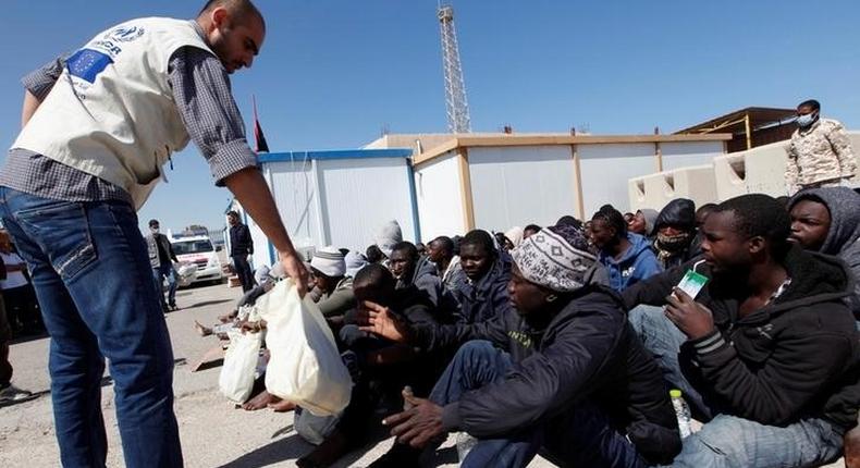 Migrants receive emergency relief in a port, after being rescued at sea by Libyan coast guard, in Tripoli, Libya April 11, 2016. 