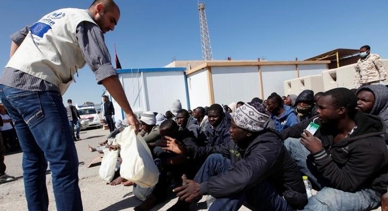 Migrants receive emergency relief in a port, after being rescued at sea by Libyan coast guard, in Tripoli, Libya April 11, 2016. 