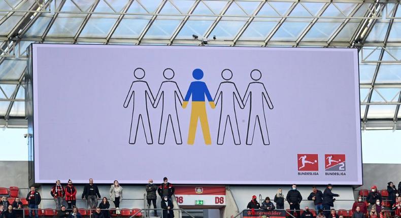 A sign at Bayer Leverkusen on Saturday shows support for Ukraine after the invasion by Russia Creator: Ina FASSBENDER